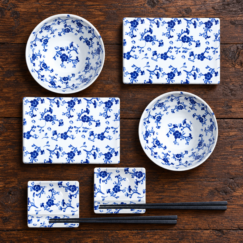 SU1-PU floral melamine set on a wood table with two plates, two bowls, two sauce dishes and two chopstick pairs