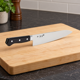 TU9005 gyuto knife on a preparation board