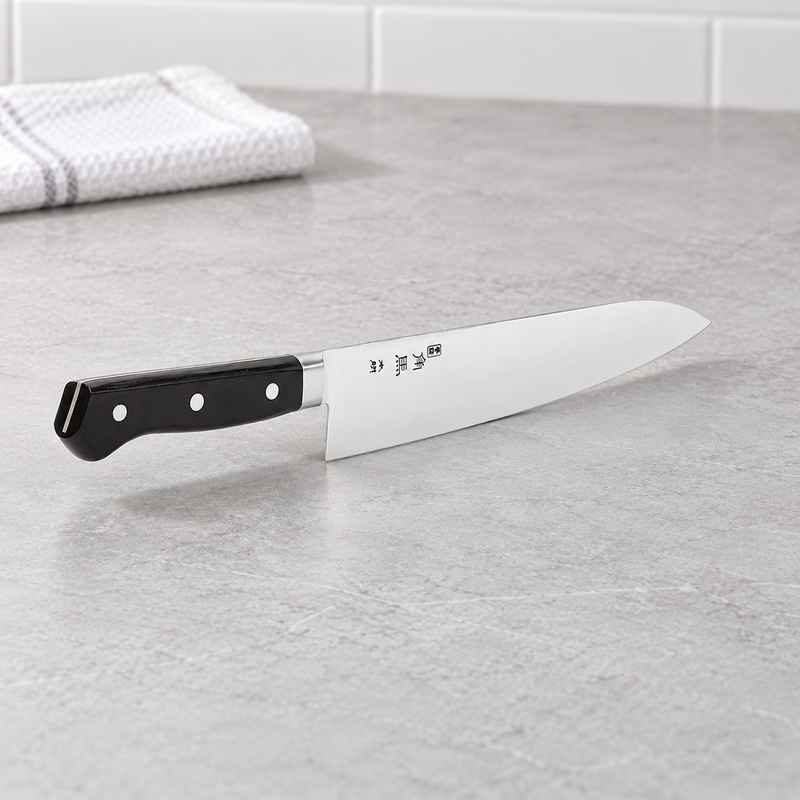 TU-9005 gyuto knife displayed on a kitchen counter