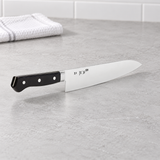 TU9005 gyuto knife on a kitchen counter