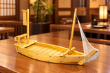 W004-75 wooden sushi boat with net on a restaurant table