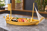 W004-75 wooden boat presenting sushi on its central deck
