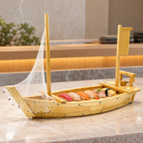 W005-75 wooden sushi boat with net and blank banner with nigiri on a stone sushi counter