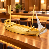 W005-90 wooden sushi boat with net and blank banner displayed empty on a wooden restaurant counter