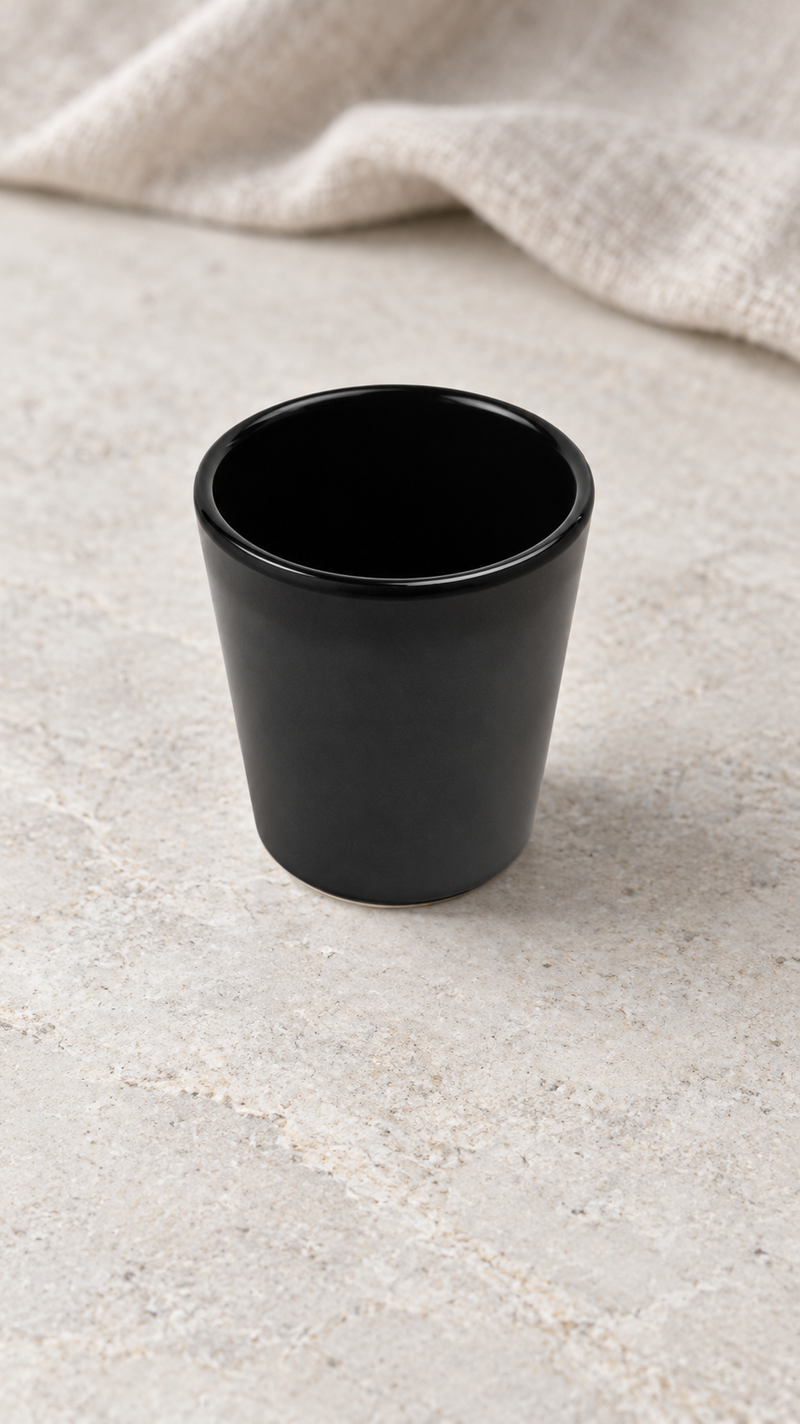 YG-002MB tapered black cup on a stone tabletop