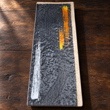 YG-5514BP rectangular brush-painted platter with orange and white accents on a wooden restaurant table