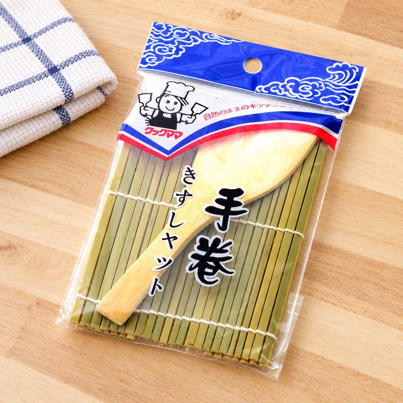 Packaged YM4 mat and spatula set on a wooden worktop