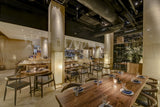 Black walnut plank live-edge tabletop in restaurant; base and seating not included