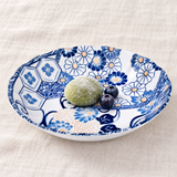 TN28-AS blue floral patterned plate with green mochi and blueberries in a table setting