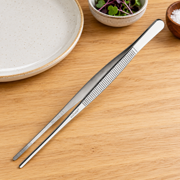 TTG-8S straight stainless-steel plating tongs in a light prep-station setting