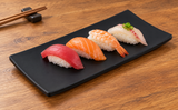 WB-62 matte-black rectangular plate with nigiri on a wooden table; serving suggestion