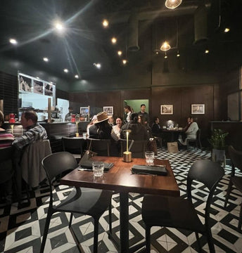 White oak butcher block tabletops in dark walnut finish in restaurant setting; bases and other furniture not included; dimensions vary by size
