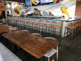 White oak butcher block tabletops in light walnut finish in restaurant setting; bases and other furniture not included; dimensions vary by size