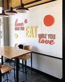 White oak butcher block tabletops in natural finish in restaurant setting; bases and other furniture not included; dimensions vary by size