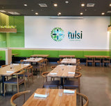 White oak butcher block tabletops in natural finish in restaurant setting; bases and other furniture not included; dimensions vary by size