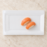 White rectangular ceramic platter with salmon nigiri