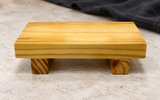 WSPW001 wooden sushi geta on a stone table
