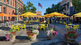 Yellow open-back plastic restaurant chair; restaurant setting, other furniture illustrative