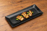 YG-5011MB matte-black plate with grilled mushrooms on a wood tabletop