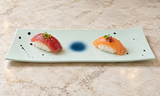 YG-5011ST White Star River plate with two nigiri on a stone table