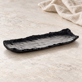 YG-5113MB irregular black platter, on a pale stone counter
