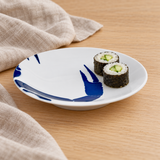 YG25-CL blue crab claw plate with cucumber sushi rolls on an oak table