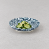 Blue spiral porcelain plate in a savory serving scene
