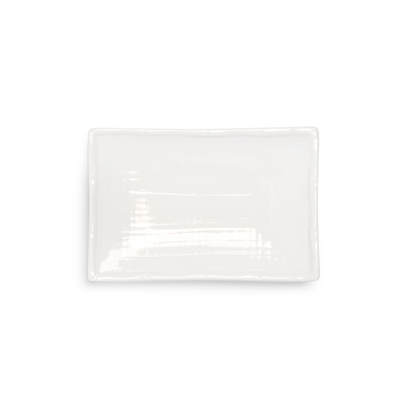 Overhead view of the white A0319 rectangular plate with fine linear surface detail