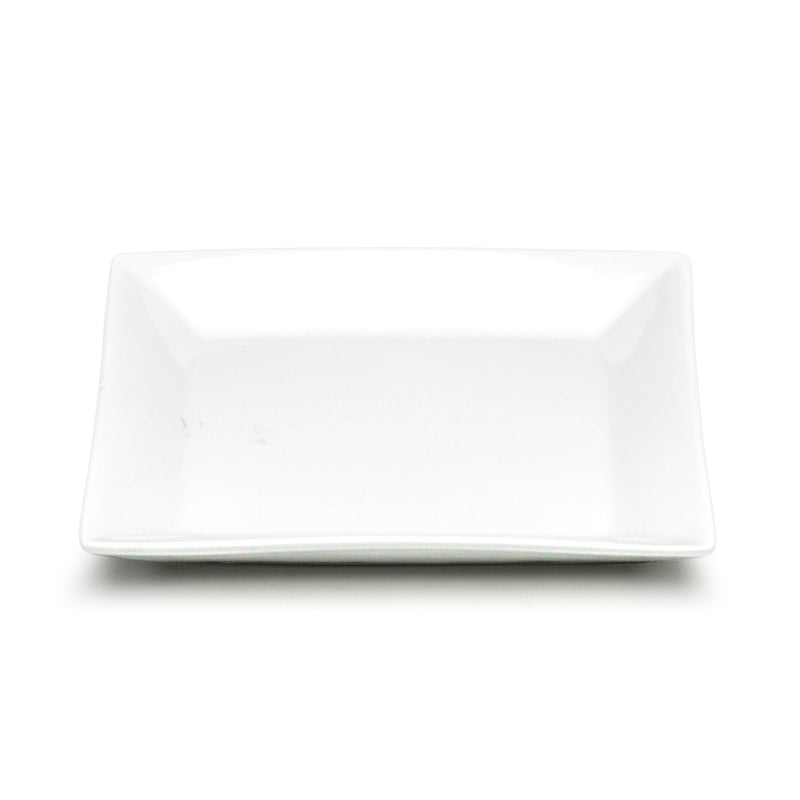 Front angled view across the empty shallow center and low square rim of the A1530 white ceramic bowl.