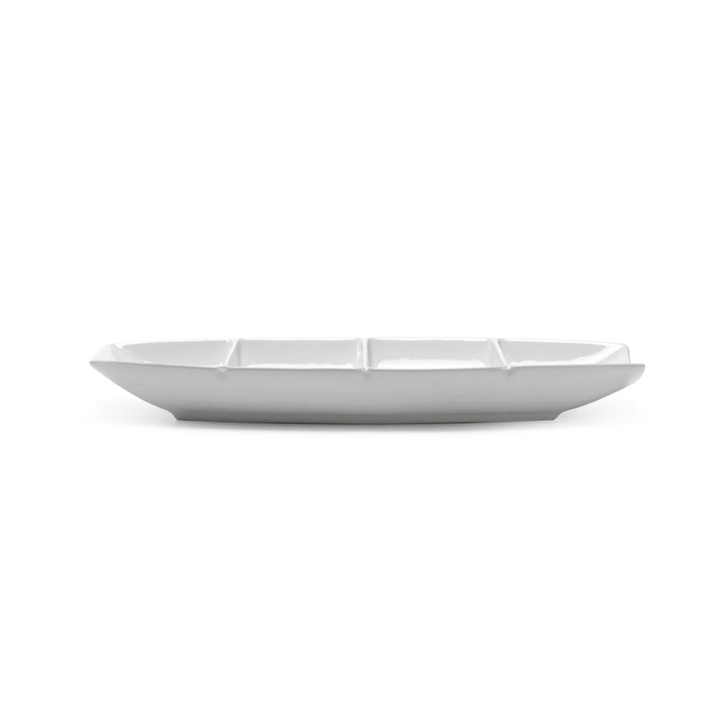 Low side view of the A18685 white ceramic boat plate with four compartments and upward-curved ends.