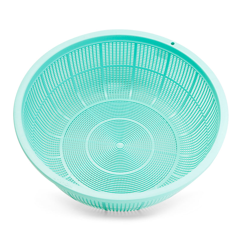 Authentic overhead view of the empty green L1 plastic mesh colander