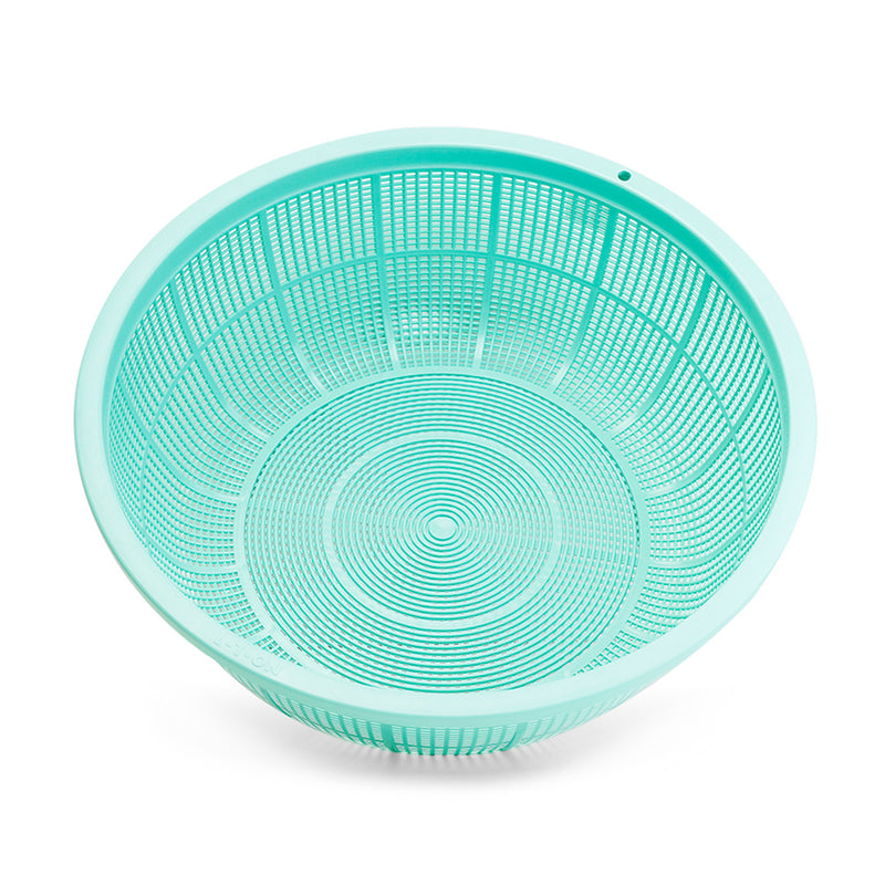 Authentic overhead view of the empty green L2 plastic mesh colander
