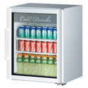 Angled view of a white refrigerated merchandiser with a single glass door and beverage display shelves.