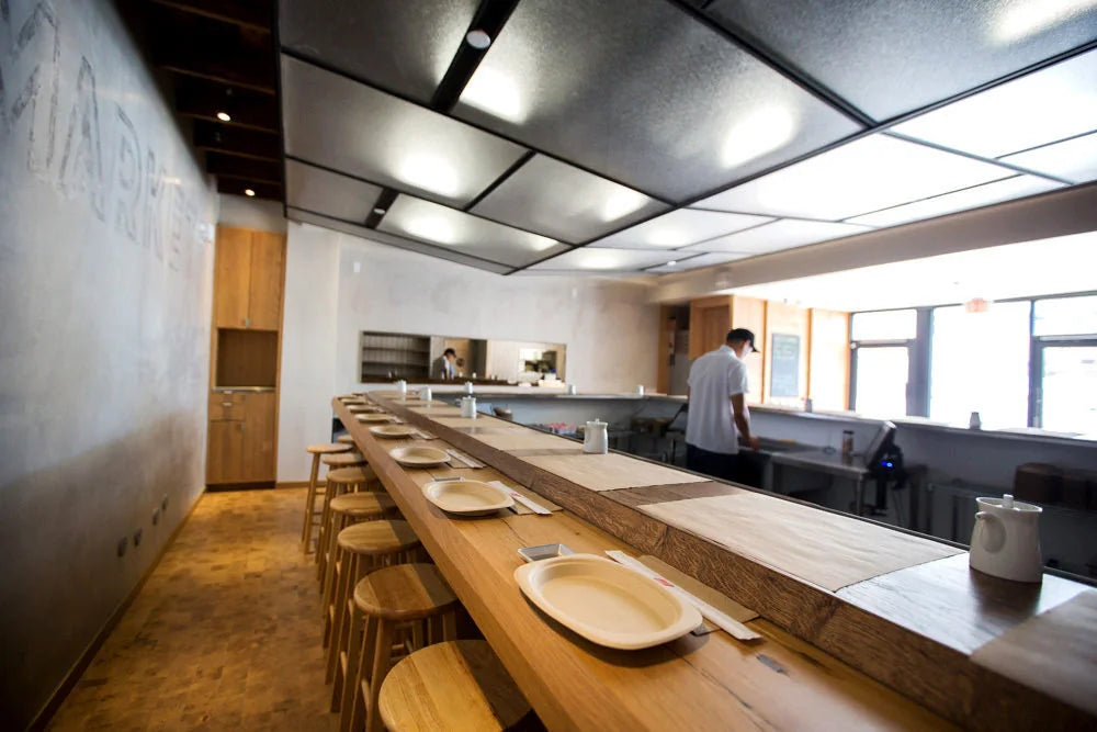 Wooden counter and stools at KazuNori in downtown Los Angeles